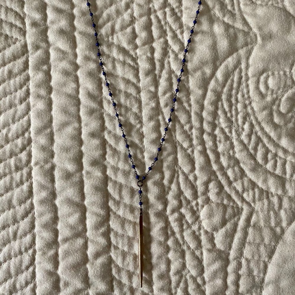 Beaded necklace with gold pendant